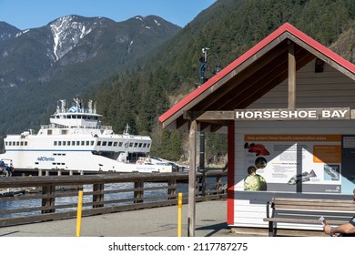 West Vancouver, BC, Canada - April 13 2021 : BC Ferries Horseshoe Bay Ferry Terminal. Cherry blossoms full bloom in springtime.