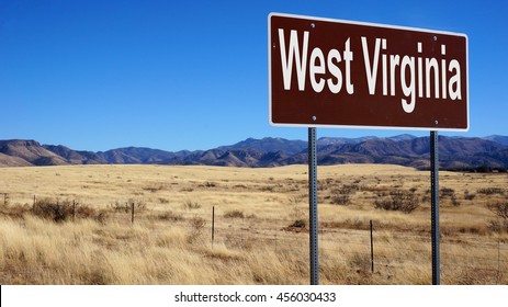 West Virginia Road Sign With Blue Sky And Wilderness