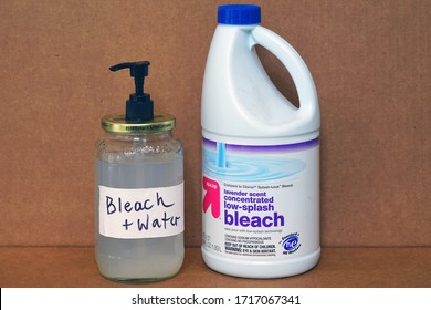 WEST WINDSOR, NJ -27 APR 2020- View Of A Bottle Of Bleach And A Jar Of Bleach Diluted In Water During The COVID-19 Pandemic.