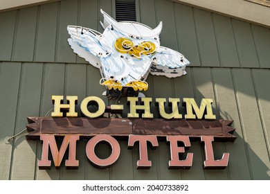 West Yellowstone, Montana - August 23, 2021: Classic neon sign featuring an owl at the Ho-Hum Motel, an option for lodging near the West Entrance of the national park