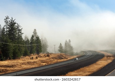 Westbound Interstate I-84 through the forest in Eastern Oregon, Pacific Northwest, USA