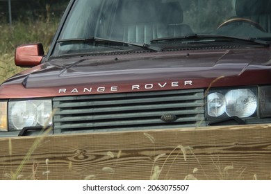 Westchester, NY - October 24, 2021: Front Of A Late 2000s Used Land Rover Range Rover Sport With Name Logo Parked In An Off Road Location