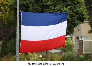 Westerbork, Netherlands- July 10, 2022: Reverse Dutch flag in Westerbork, Netherlands