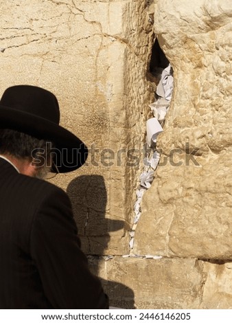 Western Wall (Wailing Wall) with worshipper and prayer slips, Jerusalem, Israel, Middle East