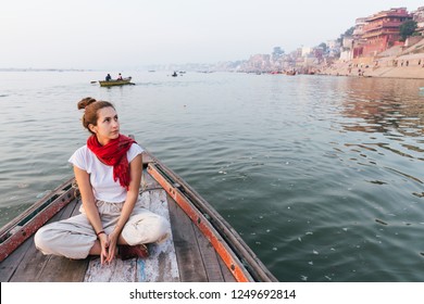 Western Woman On A Boat Exploring The River Ganges