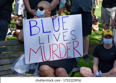 Westfield, NJ: 06/07/20: A Women Holding A Sign That Says Blue Lives Murder To Support The Black Lives Matter Movement At A Protest For George Floyd's Death