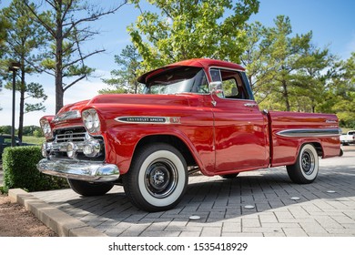 WESTLAKE, TEXAS - October 20, 2018: Front side view of a red vintage Chevrolet Apache 31 Fleetside pickup truck classic car.