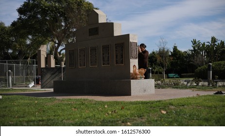 Westminster, California / USA - 1/7/2020 : Elder Vietnamese Woman Praying At A Vietnam War Memorial Park Before Tet Lunar New Year 2020