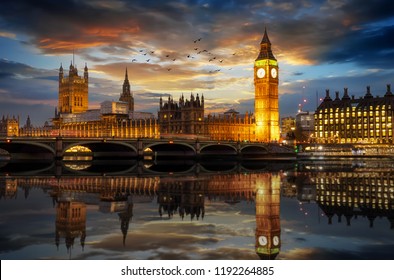 The Westminster Palace and the Big Ben clocktower by the Thames river in London, United Kingdom, just after sunset - Shutterstock ID 1192264885