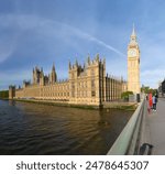 Westminster Palace and Elizabeth Tower(Big Ben) on the banks of the Thames River. These are all famous tourist attractions in London, UK.