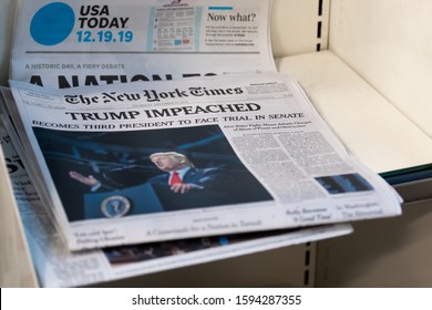 Weston, Florida/USA - December 20, 2019: Morning newspapers on the stand at local Gas station. A couple of Newspapers with top news about President Donald J. Trump Impeachment.