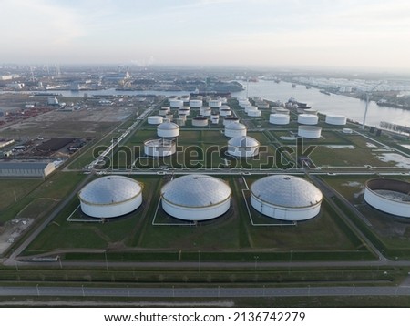 Westpoort commercial petrochemical oil gas fuel storage crude energy silos terminal at large industrial habour. Huge storage of liquid aerial drone view in the port of Amsterdam, The Netherlands.