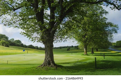 The Westwood publick parkland with golfing green and flag pole flanked by beautiful trees and spring leaves on a fine morning in Beverley, Yorkshire, UK. - Shutterstock ID 2164864993