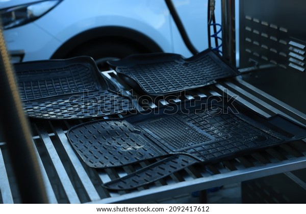 Wet auto mats at car wash,
closeup