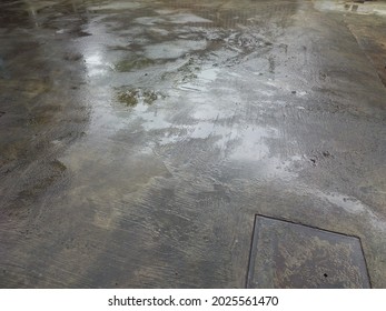 Wet Cement Floor After Rainy Day.