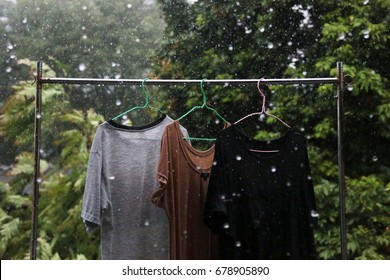 Wet Clothes Hang On The Clothes Line In The Rain Because Can Not Keep Up.