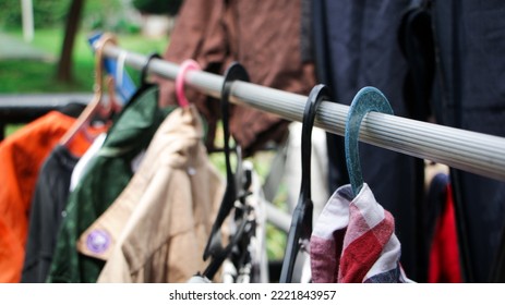 Wet Clothes Hanging On Blue And Black Hanger To In The Sun Drying