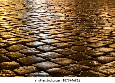 Wet Cobblestones At Night After Rain On A Street Or Road Surface, Bottom View