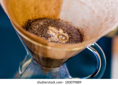 wet coffee grounds in a filter