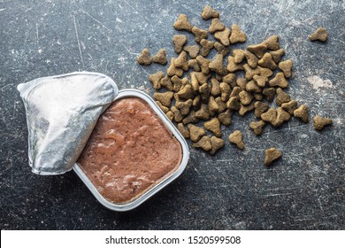 Wet And Dry Pet Food. Cat Or Dog Pate On Old Table. Top View.