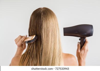 Wet and dry woman's blonde hair before and after using hair dryer on the gray background. Cares about a healthy and clean hair. Beauty salon concept. 