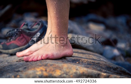 wet feet on a stone