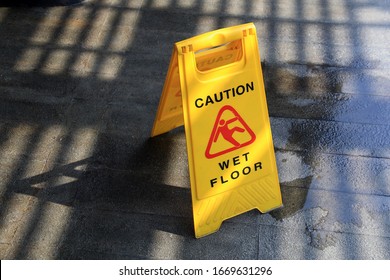 wet floor with under construction sign