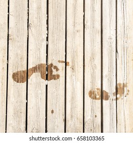 Wet Footprints On Wooden Boards