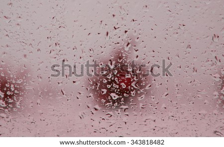 Similar – Drops on the window pane with reflection of the building opposite