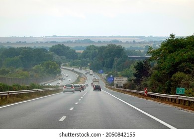 Wet highway after heavy rain. Vehicles riding with high speed by rain