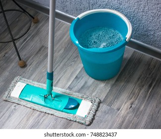 Wet House Cleaning. Mop And Bucket With Soapy Water For Floor Washing.