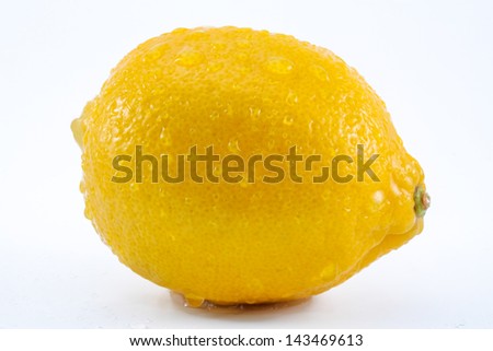 Wet lemon with water drops on white background