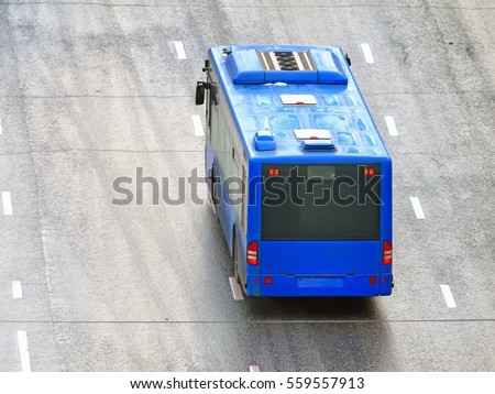 Wet multi lane wide street with modern public transportation system city blue bus aerial top down back view background