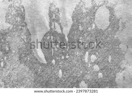 Wet paper texture with wet spots. Wet dark paper sheet with surface texture. Paper background. Full frame