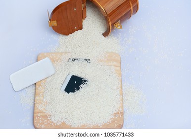 Wet Phone In Rice On Wood And Bucket Rice Background