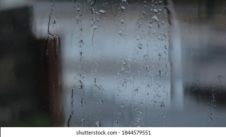 Wet Rainy Window Pane Covered In Water Droplets