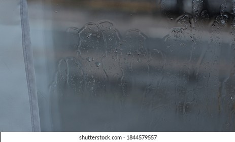 Wet Rainy Window Pane Covered In Water Droplets