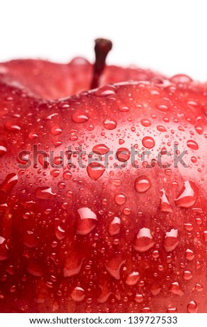 wet red delicious apple close-up