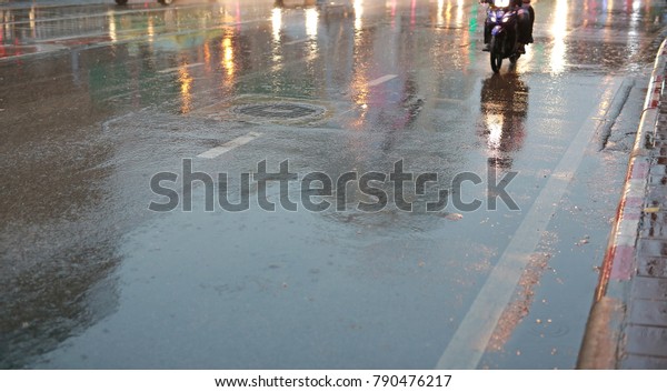 Wet road during rain at\
the morning.