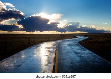 Wet Road Into Sunset