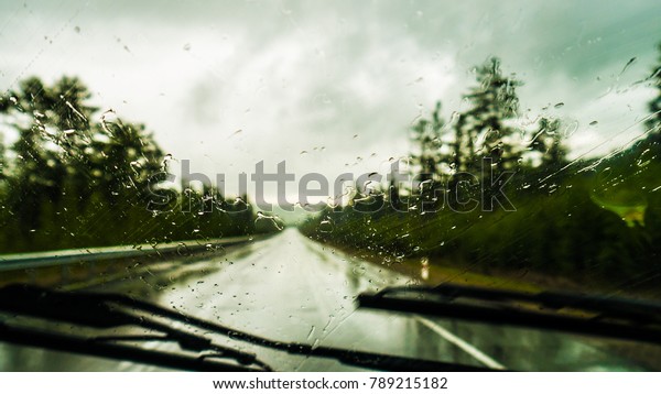 Wet road through\
glass