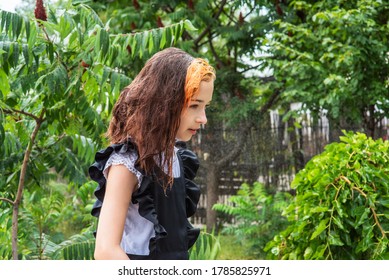 Wet Schoolgirl Standing In The Rain. Girl Wet. Teenager In School Uniform In Spring Or Warm Autumn. Girl 5th Grade. Hair Coloring. Portrait Of A Schoolgirl With Splashes Of Water. Back To School