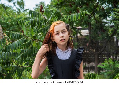 Wet Schoolgirl Standing In The Rain. Girl Wet. Teenager In School Uniform In Spring Or Warm Autumn. Girl 5th Grade. Hair Coloring. Portrait Of A Schoolgirl With Splashes Of Water. Back To School