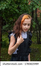 Wet Schoolgirl Standing In The Rain. Girl Wet. Teenager In School Uniform In Spring Or Warm Autumn. Girl 5th Grade. Hair Coloring. Portrait Of A Schoolgirl With Splashes Of Water. Back To School