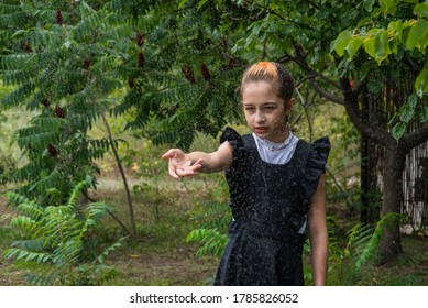 Wet Schoolgirl Standing In The Rain. Girl Wet. Teenager In School Uniform In Spring Or Warm Autumn. Girl 5th Grade. Hair Coloring. Portrait Of A Schoolgirl With Splashes Of Water. Back To School