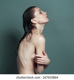 Wet Skinny Naked Girl Stands Sideways Visible Ribs