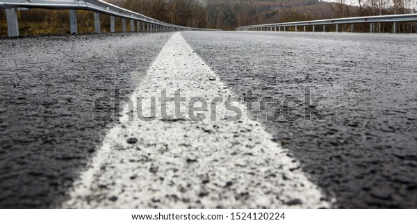 wet slippery road in bad\
weather