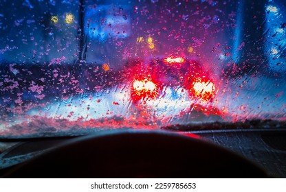 Wet and snowy winter seen through the windshield of a car - Powered by Shutterstock