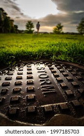 Wet Storm Drain Cover After Storm During Sunset