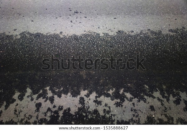 Wet street asphalt\
texture background